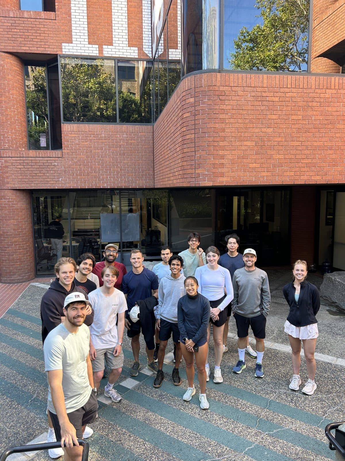 The crew gathered on the steps outside the office
