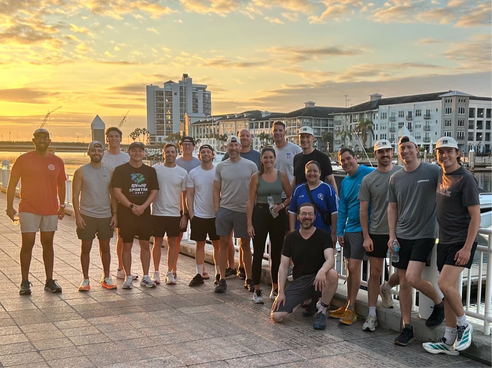 Group photo on the waterfront at sunset