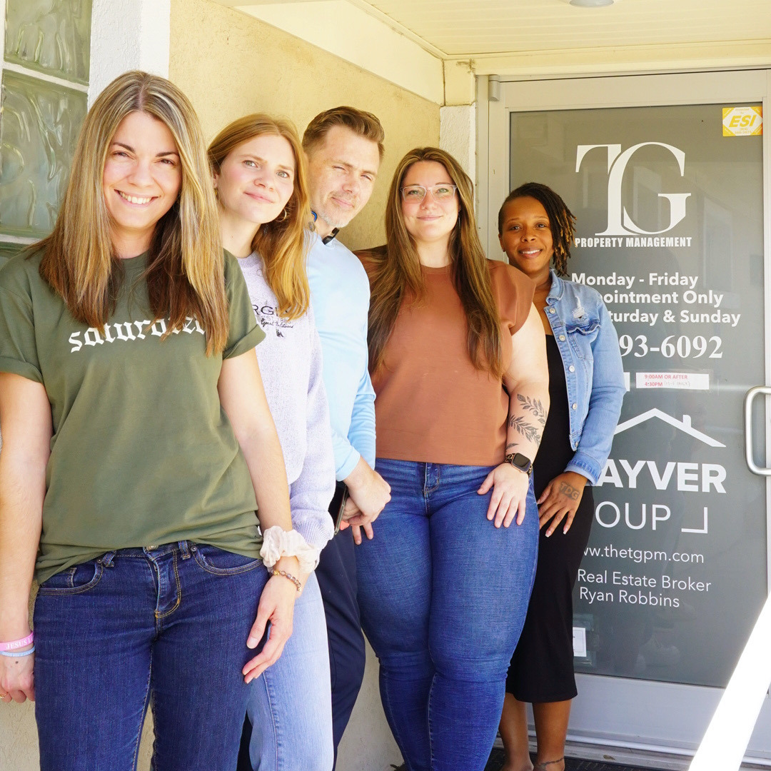 The TG Property Management team outside their Jacksonville office